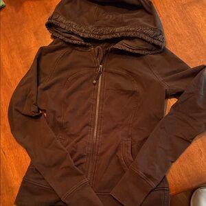 Lululemon black zip hoody sweatshirt with ruffle gathered hood detailing.